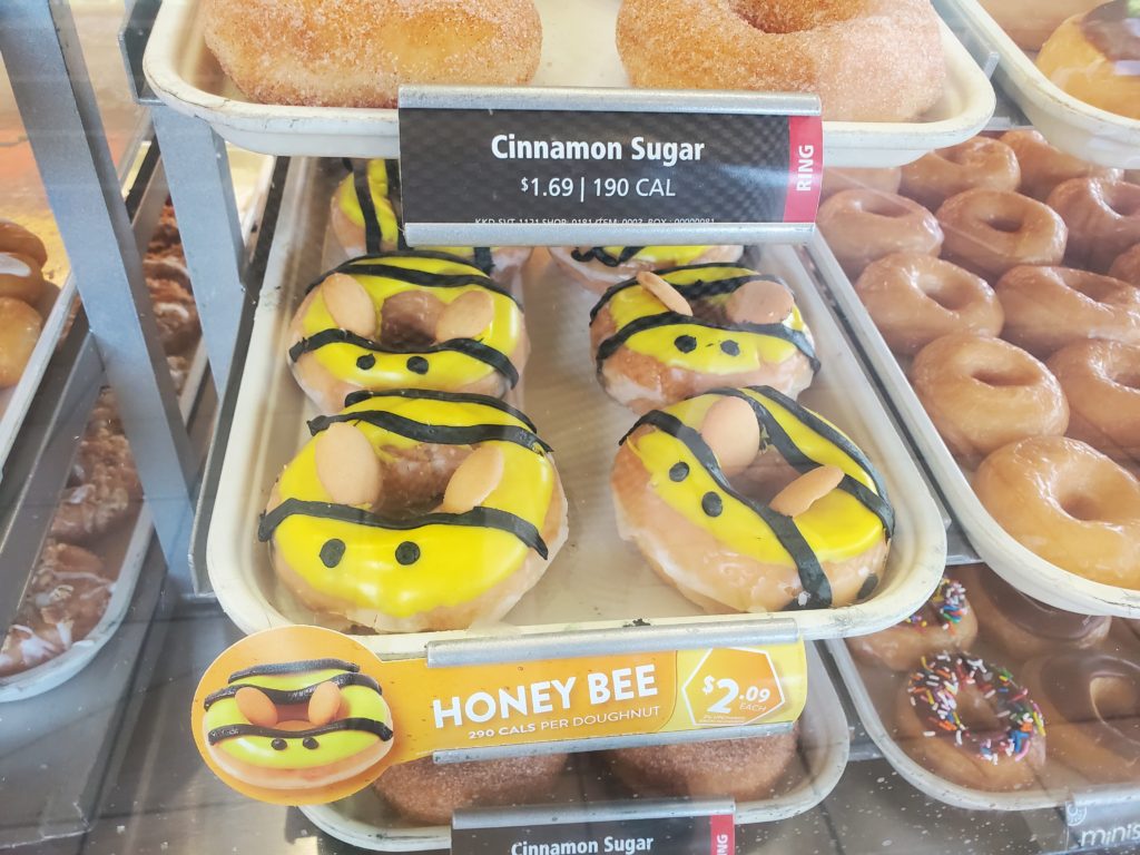 Donuts decorated with cartoon bee with cookie wings