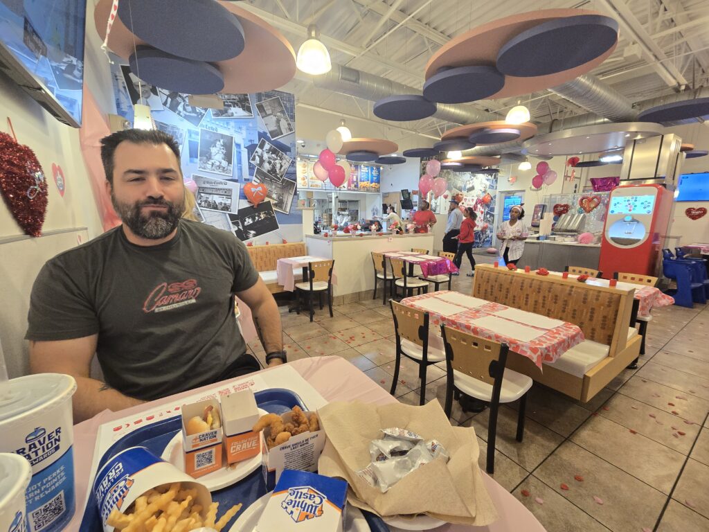 Interior of White Castle Restaurant. Rose petals on floor and tablecloths with valentine heart decor.
